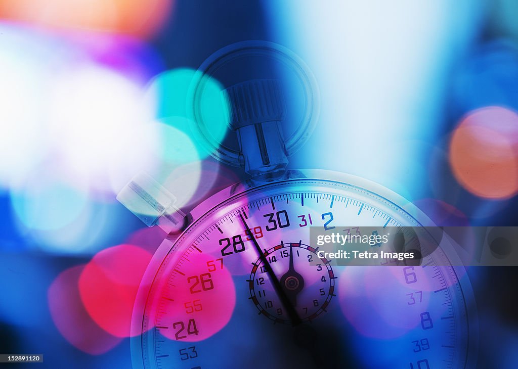 USA, New York, New York City, Stopwatch and colorful lights