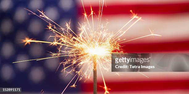 sparkler and american flag - american flag fireworks stock pictures, royalty-free photos & images