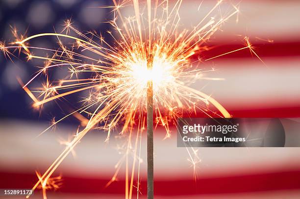 sparkler and american flag - july fourth stock-fotos und bilder