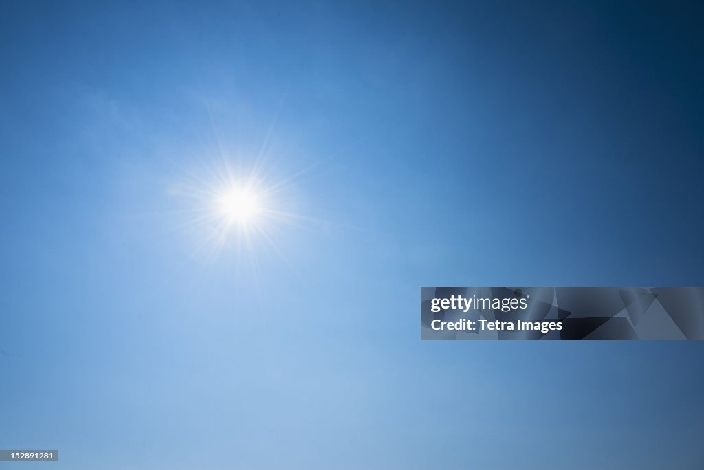 Clear blue sky and solar flare