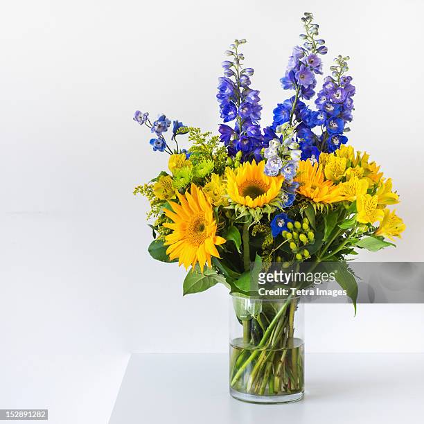 bunch of colorful flowers in vase - flower arrangement stock pictures, royalty-free photos & images