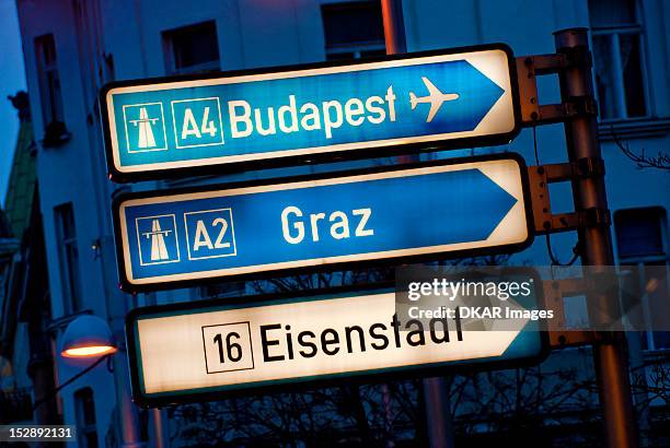 view of road signs at dusk - town sign stock pictures, royalty-free photos & images