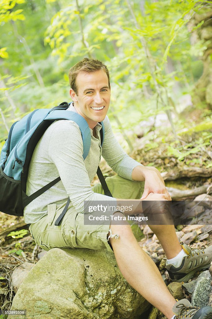 USA, New Jersey, Mendham, Portrait of man resting in forest