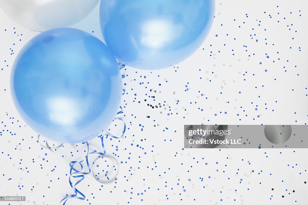Studio shot of balloons on colored spotted background
