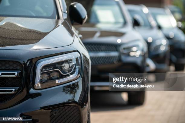 mercedes suvs at a car dealership on the outskirts of hamburg - sports utility vehicle stockfoto's en -beelden