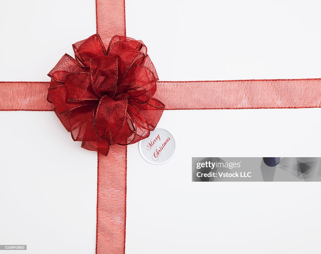 Close-up of gift with red ribbon