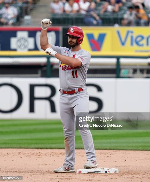 Paul DeJong of the St. Louis Cardinals reacts at second base following his RBI double during the tenth inning of a game against the Chicago White Sox...