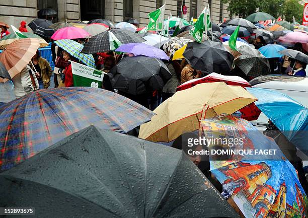 Government employees take part in a demonstration against the Spanish government's latest austerity measures in the center of Madrid on September 28,...