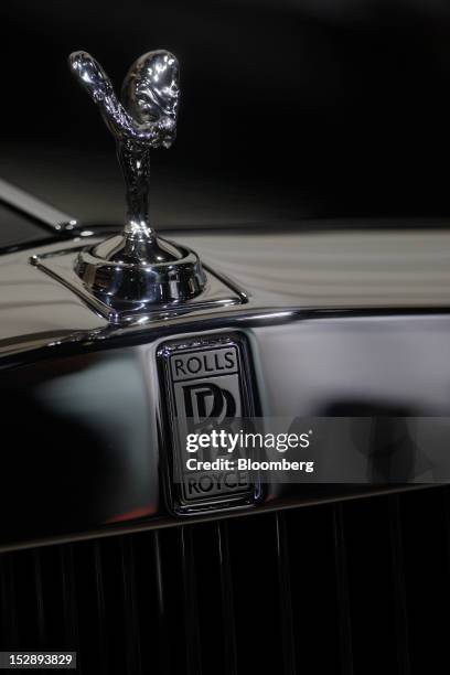 The Spirit of Ecstasy or "Flying Lady" mascot sits on the hood of a Rolls-Royce Phantom luxury automobile, produced by Rolls-Royce Motor Cars Ltd.,...