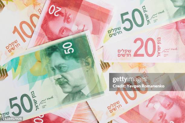 israeli shekel as a background - israel market stock pictures, royalty-free photos & images