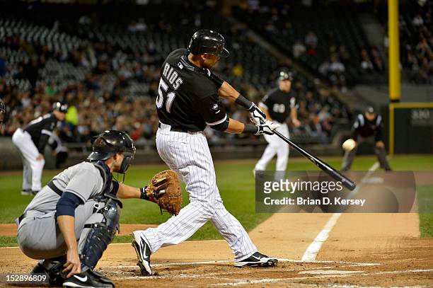 Alex Rios of the Chicago White Sox bats as Lou Marson of the Cleveland Indians catchers at U.S. Cellular Field on September 26, 2012 in Chicago,...