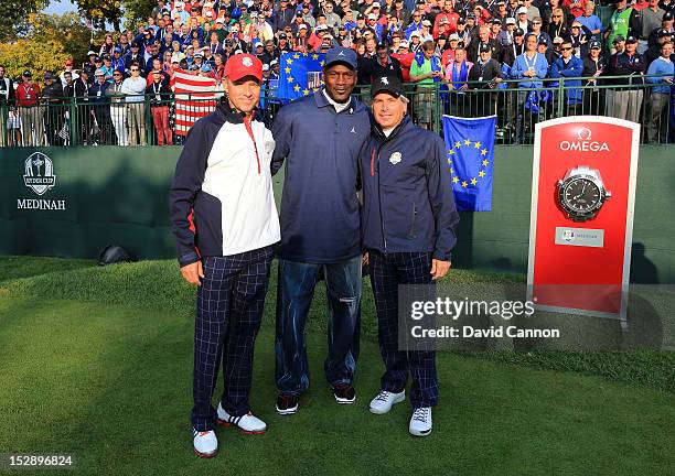 Team captain Davis Love III poses with Michael Jordan and Fred Couples on the first tee during the Morning Foursome Matches for The 39th Ryder Cup at...