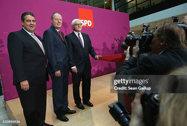 German Social Democrat Peer Steinbrueck , SPD Chairman Sigmar Gabriel and SPD Bundestag faction leader Frank-Walter Steinmeier pose for photographers...