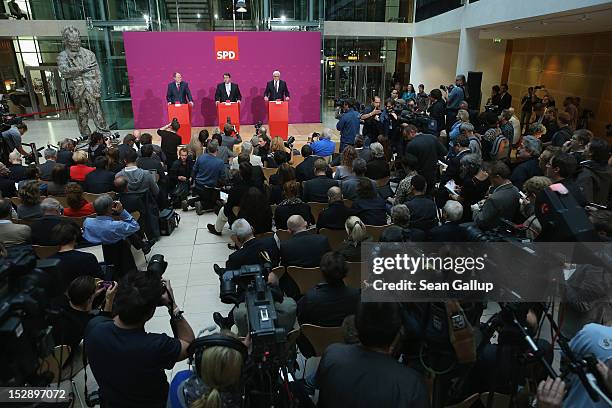 German Social Democrat Peer Steinbrueck , SPD Chairman Sigmar Gabriel and SPD Bundestag faction leader Frank-Walter Steinmeier give a statement to...