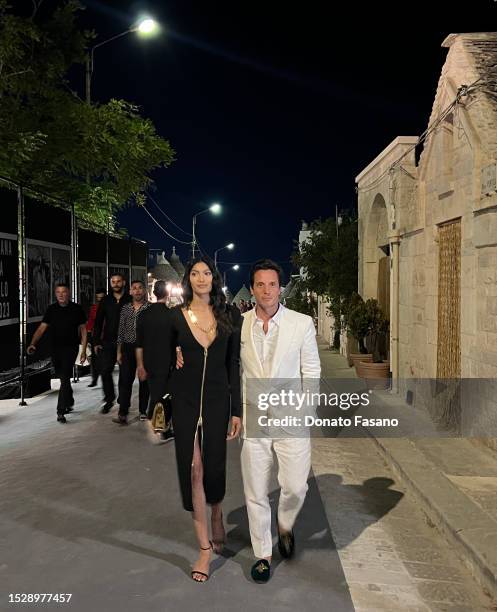 Pritika Swarup and John Giordano are seen during the Alta Moda Dolce & Gabbana show at Alberobello on July 09, 2023 in Bari, Italy.