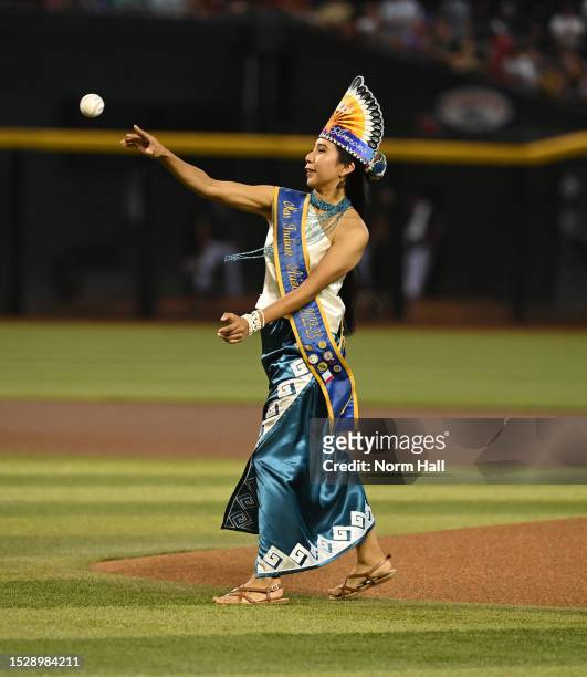 Miss Indian Arizona Sistine Lewis throws out the ceremonial first pitch on Native American Recognition Day prior to a game between the Arizona...