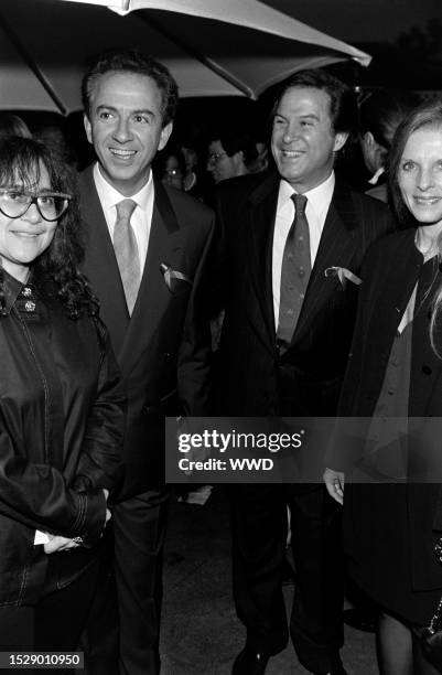 Guest, Paul Marciano, and Georges Marciano attend an event on the Sony lot in Culver City, California, on September 24, 1992.