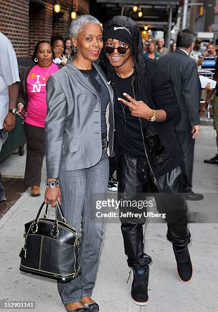 Musician Lupe Fiasco and his mother depart "Late Show with David Letterman" at Ed Sullivan Theater on September 27, 2012 in New York City.