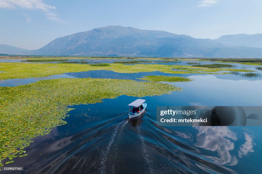 Traditional Boat on Lake with Water Lilies. Civril, Denizli, Turkey