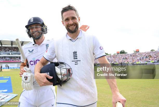 England players Mark Wood and Chris Woakes celebrate as they leave the field after day four of the 3rd LV= Ashes Test Match at Headingley on July 09,...