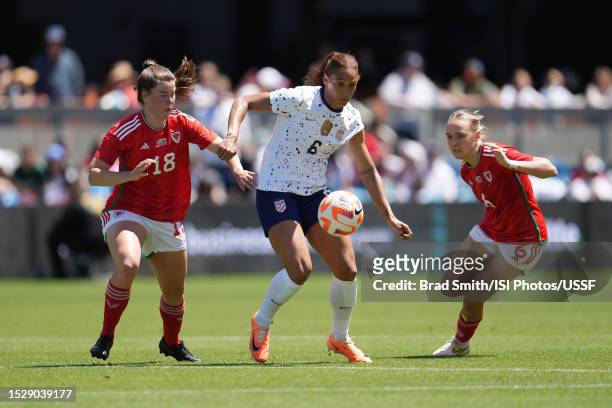 Lynn Williams of the United States is defended by Esther Morgan and Jose Green of Wales during the second half of an international friendly at PayPal...