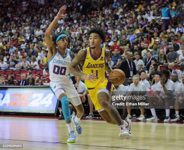 Jalen Hood-Schifino of the Los Angeles Lakers drives against Nick Smith Jr. #00 of the Charlotte Hornets in the second half of a 2023 NBA Summer...