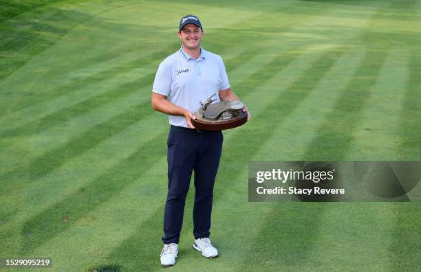 Sepp Straka of Austria poses with the trophy after winning the John Deere Classic at TPC Deere Run on July 09, 2023 in Silvis, Illinois.