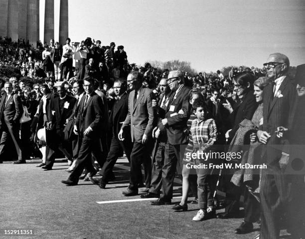 View of demonstrators as they pass the Lincoln Memorial during the 'March on the Pentagon,' Washington DC, October 21, 1967. Among those visible are,...