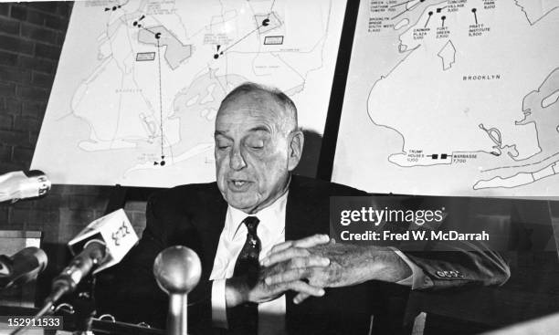 American public official, city planner, and Director of the Triborough Bridge and Tunnel Authority Robert Moses answers questions at a press...