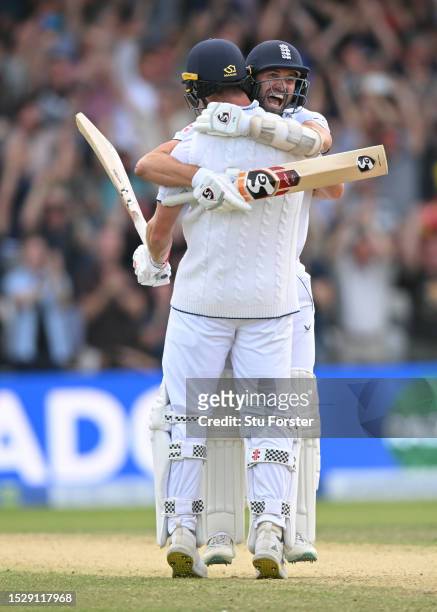 England players Mark Wood and Chris Woakes celebrate victory after day four of the 3rd LV= Ashes Test Match at Headingley on July 09, 2023 in Leeds,...