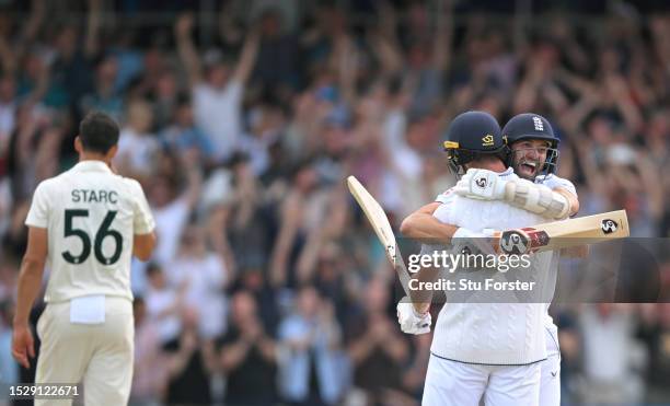 England players Mark Wood and Chris Woakes celebrate victory after day four of the 3rd LV= Ashes Test Match at Headingley on July 09, 2023 in Leeds,...