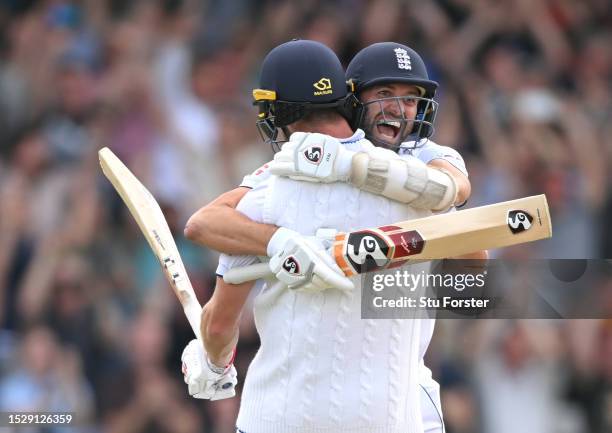 England players Mark Wood and Chris Woakes celebrate victory after day four of the 3rd LV= Ashes Test Match at Headingley on July 09, 2023 in Leeds,...