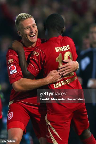 Francky Sembolo of Regensburgcelebrates scoring the 3rd team goal with his team mate Christian Rahn during the Second Bundesliga match between Jahn...