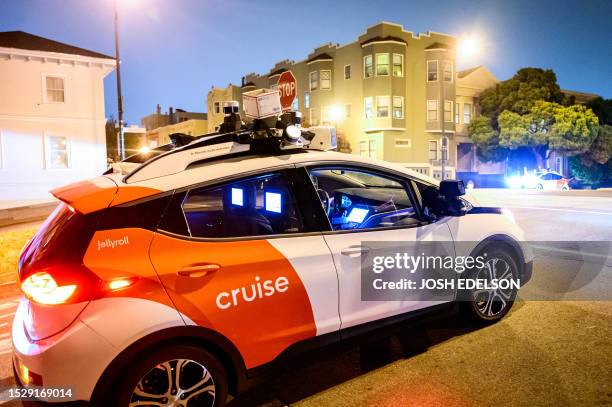 Box placed on the LIDAR scanner of a robotaxi disables it across from another disabled robotaxi in San Francisco, California on July 11, 2023....