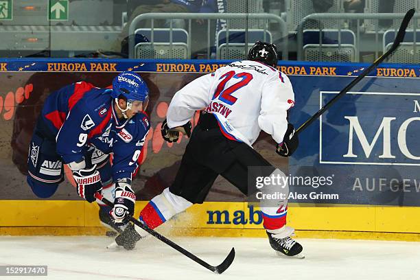 Marcel Goc of Mannheim is challenged by Yan Stastny of Ice Tigers during the DEL match between Adler Mannheim and Thomas Sabo Ice Tigers at SAP Arena...