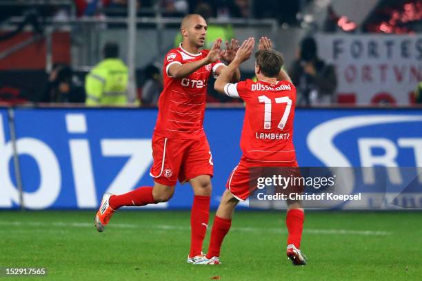 Dani Schahin celebrates the first goal with Andreas Lambertz of Duesseldorf during the Bundesliga match between Fortuna Duesseldorf and FC Schalke 04...