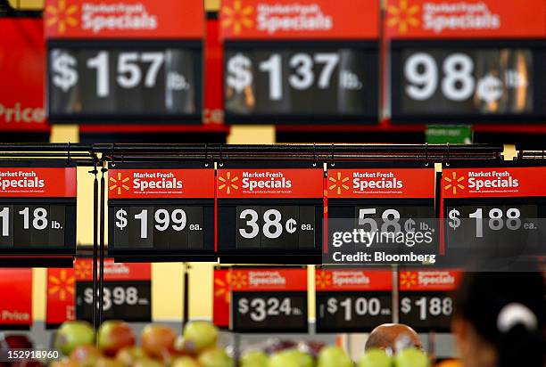 Produce pricing signs are displayed during the grand opening of a Wal-Mart Stores Inc. Location in Panorama City, California, U.S., on Friday, Sept....