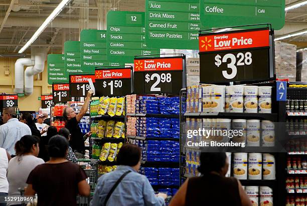 Customers shop during the grand opening of a Wal-Mart Stores Inc. Location in Panorama City, California, U.S., on Friday, Sept. 28, 2012. Wal-Mart...