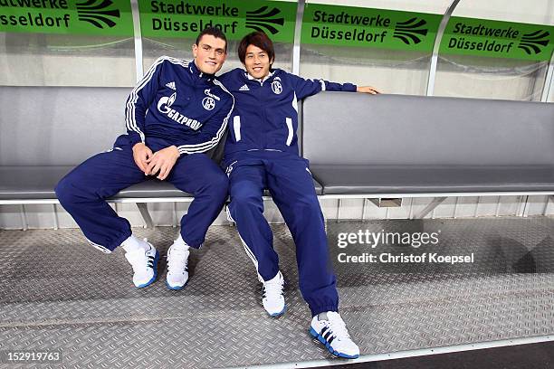 Kyriakos Papadopoulos and Atsuto Uchida of Schalke pose prior to the Bundesliga match between Fortuna Duesseldorf and FC Schalke 04 at Esprit-Arena...