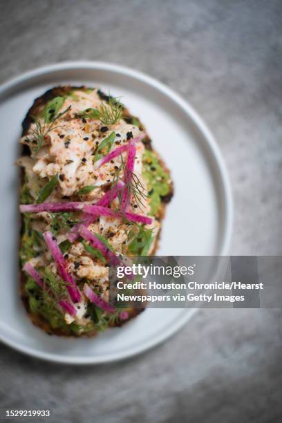 Blue crab tartine with avocado and ravigote at Eunice, a Cajun-Creole brasserie, Friday, Oct. 5 in Houston.