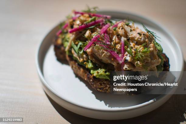 Blue crab tartine with avocado and ravigote at Eunice, a Cajun-Creole brasserie, Friday, Oct. 5 in Houston.