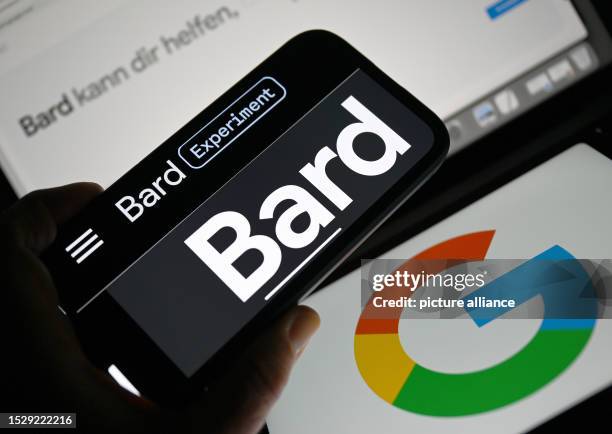 July 2023, Hesse, Frankfurt/Main: The word "Bard" can be seen on the display of a smartphone in front of two Google logos. Google's AI chatbot Bard...