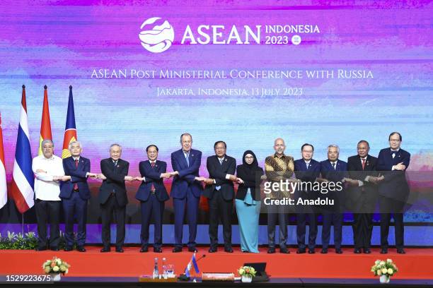 Russian Foreign Minister Sergei Lavrov poses for a photo with other foreign ministers and officials as part of the ASEAN Post Ministerial Conference...