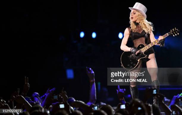 American singer Madonna performs onstage at the Cardiff Millennium Stadium on August 23, 2008 during the first concert of her "Sticky and Sweet"...