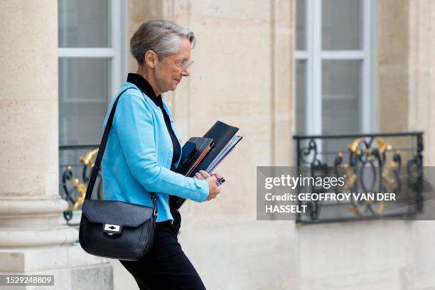 France's Prime Minister Elisabeth Borne leaves the presidential Elysee Ppalace after he attended the weekly cabinet meeting in Paris on July 13, 2023.