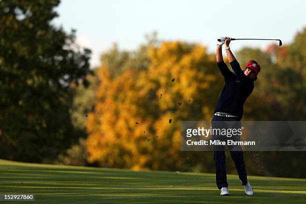 Bubba Watson of the USA plays his approach shot to the 14th green during the Afternoon Four-Ball Matches for The 39th Ryder Cup at Medinah Country...