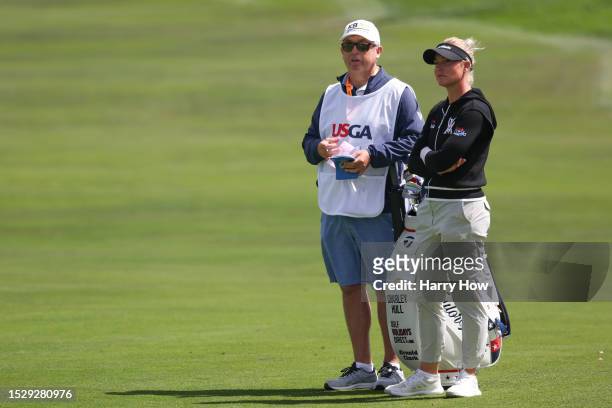 Charley Hull of England waits with her caddie Adam Woodward on the 14th fairway during the final round of the 78th U.S. Women's Open at Pebble Beach...
