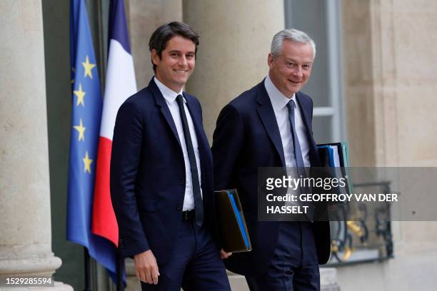 France's Junior Minister for Public Accounts Gabriel Attal and France's Minister for the Economy and Finances Bruno Le Maire leave the presidential...