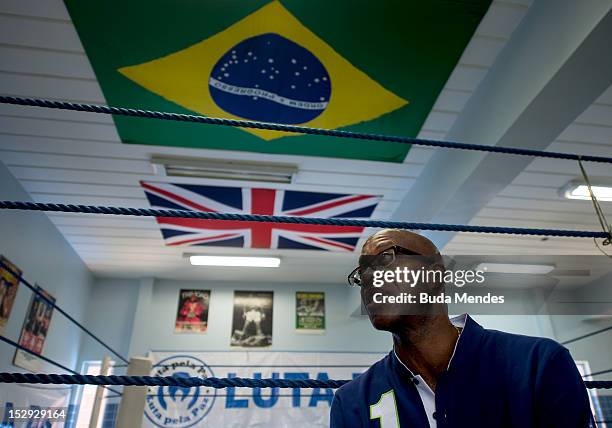 Lauerus Ambassador and former athlete Edwin Moses poses for a picture during an official visit to Luta Pela Paz Project at Complexo da Mare on...