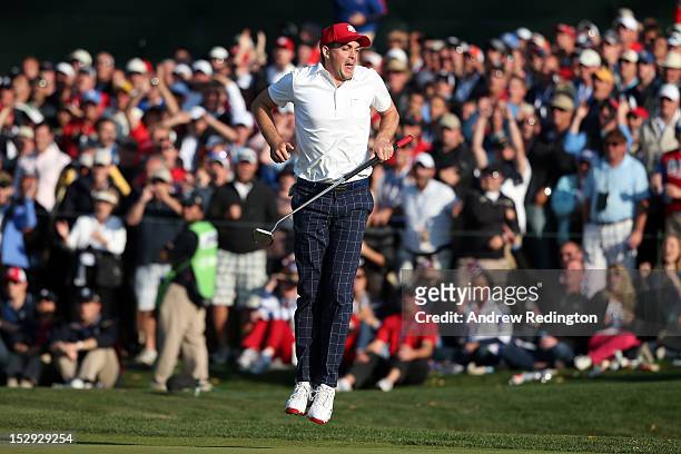Keegan Bradley of the USA reacts to a missed putt on the 15th green during the Afternoon Four-Ball Matches for The 39th Ryder Cup at Medinah Country...